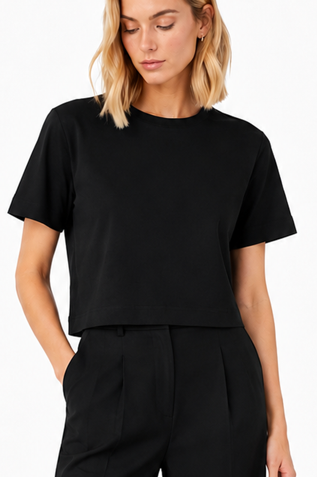 Model wearing BLACKPANTS Boxy Tee with relaxed oversized fit