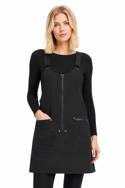 Model wearing BLACKPANTS Pinny layered over a long sleeve top with leggings